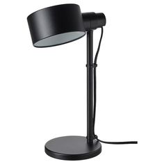 a black table lamp with a white light on it