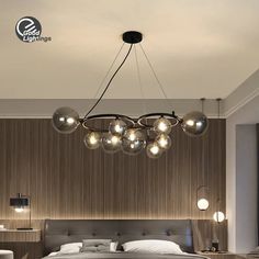 a bedroom with a large bed and lots of lights hanging from the ceiling