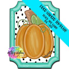 a blue and white polka dot frame with an orange pumpkin on it's side