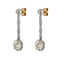 A sleek and sexy pair of ART DECO 6.53ctw Diamond Drop Earrings in Platinum and Gold, dating from CIRCA 1920s.Unique and Exquisite pair of these Authentic Art Deco Earrings will take your breath away! Platinum Dangles are encrusted with Old European and old swiss cut diamonds every step of the way!.The old cut larger diamonds drops are set into prongs weighing 2.62ct S-T VS2 and 2.68ct: in O-P color, VS1 clarity overall, GIA certified; Diamonds are an eye clean and extremely bright and sparkly ( Classic Diamond White Pierced Earrings, Classic Diamond Cut Earrings For Evening, Classic Formal Diamond Pierced Earrings, Classic Formal Diamond Drop Earrings, Classic Formal Pierced Diamond Earrings, Classic Diamond Drop Earrings With 17 Jewels, Classic Platinum Drop Earrings, Timeless Round Linear Earrings For Formal Events, Timeless Round Linear Earrings For Formal Occasions