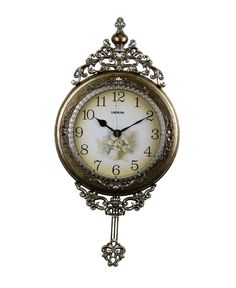 an ornate clock is hanging on the wall