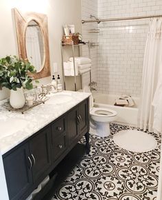 the bathroom is decorated in black and white