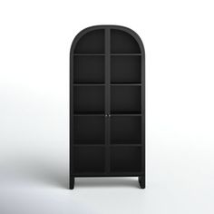 a black bookcase with an arched door on the top and bottom shelf, in front of a white background