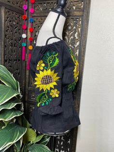 A very nice and beautiful Sunflower Blouse w/Gorgeous Embroidery. The design work is simply gorgeous. Perfect for your ultimate weekend look, beach, casual look or just to impress your friends with this gorgeous piece. You will Love it! Blouse STYLE DETAILS Overview * Round neck * Handmade work * 3/4 Long sleeves fabric & care * hand wash * delicate care * hang dry Please email me your questions before buying email me TODAY All of my items come from a smoke and pet free environment. Thank yo Summer Long Sleeve Top With Floral Embroidery, Summer Casual Peasant Top With Intricate Embroidery, Spring Beach Peasant Top With Multicolor Embroidery, Embroidered Yellow Summer Blouse, Embroidered Summer Blouse For Vacation, Summer Bohemian Embroidered Top With Intricate Embroidery, Yellow Embroidered Summer Blouse, Bohemian Embroidered Summer Blouse, Bohemian Peasant Top With Multicolor Embroidery For Beach