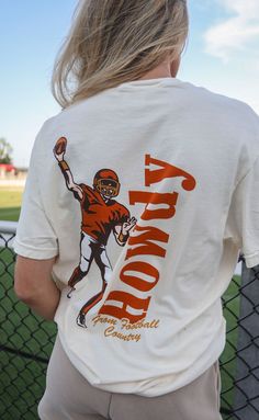 Say HOWDY! from football country in this off-white tee complete with a vintage inspired illustration of a quarterback mid pass! We love the red and yellow colorway of this design. 


Haley is 5'6" and is wearing size medium

Maggie is 5'4" and is wearing an XL for an oversized look


sizing guide: 


fits true to size - size up for an oversized fit

medium measurements: 41" bust and 28.5" length

100% cotton


WE ONLY OFFER STORE CREDIT FOR RETURNS! Feel free to email us at orders@shopriffraf Off White Tees, Football Graphic Tee, Inspired Illustration, Vintage Football Shirts, Western Tee, Football T Shirt, Vintage Football, Gameday Outfit, Red And Yellow