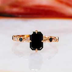 Black Emerald Wedding Set, Black Diamond Ring, Black Wedding Band, Black White Ring Set, Black Emerald Ring, Multi stone Black Bridal Set 🖤Setting Total Carat Weight: 3.3 Carats 14K Rose Gold Certificate Of Authenticity Included 🖤Main Diamond: Shape: Emerald Cut Weight: 1.5 Carats Color: Fancy Black Clarity: Opaque Color Origin: Enhanced Color Distribution: Even Grade: AAA Measurements:  mm Stock ID: 🖤Accent Diamonds  Shape: Round & Marquise Weight: Black & White Carats Color: Black Clarity: Opaque Color Origin: Enhanced Color Distribution: Even Grade: AAA Stock ID: Notes: 🖤All diamonds are natural, earth-mined diamonds that were suitable for Color Enhancement into Fancy Black color. 🖤Black diamonds are known to be difficult to cut and polish because Of their structural patterns, Some Luxury Onyx Jewelry For Weddings, Black Spinel Rings For Anniversary, Anniversary Black Spinel Rings, Elegant Black Emerald Cut Jewelry, Black Emerald Cut Diamond Jewelry, Black Emerald-cut Diamond Jewelry, Black Diamond Jewelry With Emerald Cut, Luxury Black Spinel Jewelry For Wedding, Onyx Gemstone Rings For Wedding