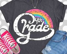 a black shirt with the words 4th grade on it and pink converse shoes next to it