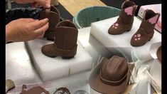 someone is making chocolate shoes out of fondant