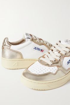 Gold Medalist Low metallic leather sneakers | AUTRY | NET-A-PORTER Luxury Sneakers Women 2023, Autry Sneakers Outfit, Autry Shoes, Golden Sneakers, Autry Sneakers, Gold Outfit, Metallic Sneakers, Gold Sneakers, Flag Logo