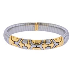 18k gold and stainless steel Tubogas Alveare bracelet by Bvlgari. DESIGNER: Bvlgari MATERIAL: 18k Gold/ Stainless Steel GEMSTONES: None DIMENSIONS: Bracelet will fit approx. 6.75" wrist and is 10mm wide. MARKED/TESTED: Bvlgari, 750, Gold and Steel, M. WEIGHT: 39.3 grams CONDITION: Estate Bulgari Jewelry, Stunning Jewellery, Steel Bracelet, Estate Jewelry, Beautiful Things, Gold Bracelet, 18k Gold, Jewelry Design, Fashion Jewelry