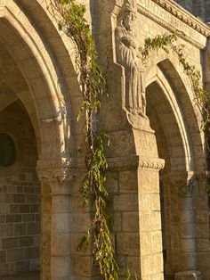 an old stone building with ivy growing on it