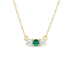 Let the subtle and sweet sparkle of this emerald and diamond necklace instantly upgrade the look of your LBD, business suit, or your basic jeans and tee. This dainty piece features a short row of five diamonds held by a yellow gold necklace chain. This necklace with a radiant five-stone pendant looks perfect when worn alone or layered with other minimalist necklaces. Emerald And Diamond Necklace, Minimalist Necklaces, Gold Necklace Chain, Basic Jeans, Yellow Gold Necklace, Eternity Ring Diamond, Business Suit, Fancy Color Diamonds, Gold Chain Necklace