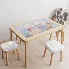 the children's table and stools are all made out of wood