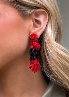 Pierce + Hide specializes in statement earrings to level up your classic style. These high-quality, on-trend earrings are perfect for gifting! 2.5” drop length Tiered design Red and Black Nickel and Lead free Elegant Red Tassel Drop Earrings, Trendy Red Tassel Earrings, Red Tassel Beaded Earrings, Red Beaded Tassel Earrings, Elegant Red Beaded Earrings With Fringe, Elegant Red Beaded Fringe Earrings, Elegant Red Tassel Earrings With Fringe, Red Tassel Chandelier Drop Earrings, Trend Earrings