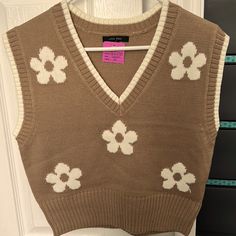 Nwt, Brown And White Floral Sweater Vest. Perfect Condition. Size Small Brown Cotton Sweater For Spring, Cute Cotton Sweater Vest For Fall, Cute Cotton Sweater Vest For Spring, White Crew Neck Sweater Vest For Spring, Trendy White Winter Sweater Vest, Trendy White Sweater Vest For Spring, Trendy White Sweater Vest, Spring Cream Cotton Sweater Vest, White Cotton Sweater Vest For Fall