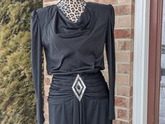 This 80s dress has lovely gothic elements, and channels your inner Morticia or Lady Gaga.  Size: Brand: Lola Berent  Shop Policies & Info Shipping (Domestic): Items ship to the address provided by Etsy, so please update your shipping address before an order is placed.  Orders ship within 72 Hours After Payment ( Except Sundays & Holidays when the USPS is closed), items are mailed by USPS, First Class mail (3-5 business days), unless other arrangements were made via Etsy upgraded expedited shipping. NOTE: you the customer are responsible for handling lost packages and retrieving insurance through USPS for first class package insurance. All items come with $50 insurance, if you wish for more insurance please message seller upon checkout. A lost package cannot be refunded. International order 80s Black Dress, Goth Glamour, Gothic Elements, 80s Dress, 72 Hours, Dress Clothes For Women, Lady Gaga, Shop Policies, Knit Dress