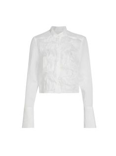 The Patti Ruffle Blouse by TWP is crafted from a cotton-silk blend for a luxurious, lightweight feel. The blouse embraces femininity with its semi-sheer outer and ruffle detailing at the front. It is completed with barrel button cuff sleeves and concealed front button closures. [tab] Composition: 78% cotton, 22% silk Size and Fit: Runs True to Size Care Instructions: Dry Clean Only Origin: Made in USA SKU: TWP49R161-IVO Questions about size, fit, or how to style? The KZ team is here to help you Band Collar Blouse, Ruffle Collar Blouse, White Ruffle Blouse, Organza Blouse, Evening Jumpsuit, Haute Hippie, Ruffle Collar, Band Collar, Cotton Blouses