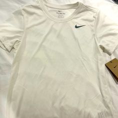 Nwt White Unisex Nike Dry Fit Sports Tee. Perfect For Tennis. Basic White Go-dry Tops, Nike Go-dry Tops For Light Sports, White Nike T-shirt For Workout, Nike White Workout T-shirt, Nike Basic Moisture-wicking Tops, Nike White T-shirt For Workout, Basic White Moisture-wicking Activewear, Nike White Tops For Light Sports, Nike White Top For Light Sports