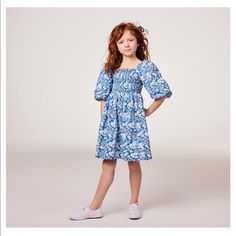 The Natalie Floral Smocked Bubble Sleeve Dress Color Lux Lapis Floral Item 100041983 An Of-The-Moment Floral Dress We Love, With Dramatic Bubble Sleeves And Stretch Smocking On The Front, Plus Pintuck Details At The Hems For The Perfect Finishing Touches. It’s Ready For Special Occasions, Or Anytime. 100% Cotton Batiste Fully Lined Button Back Short Sleeve Matching Family Styles Available Machine Washable; Imported Spring Dress With Smocked Bodice For Playdate, Playful Smocked Dress For Spring With Smocked Bodice, Playful Smocked Dress With Smocked Bodice For Spring, Spring Playful Smocked Dress With Smocked Bodice, Smocked Dress With Smocked Bodice For Summer Playdate, Summer Smocked Dress With Smocked Bodice For Playdate, Summer Dress With Smocked Bodice For Playdate, Spring Smocked Dress For Playdate, Playful Smocked Dress For Spring Playdate