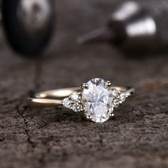 a close up of a diamond ring on the ground