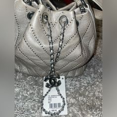 Never Used Tag Still Attached Luxury Shoulder Bag With Branded Hardware, High-end Pouch Bucket Bag For Shopping, Designer Crossbody Bucket Bag For Shopping, Designer Pouch Shoulder Bag, Luxury Pouch Bags As Fashion Accessory, Designer Travel Shoulder Bag With Chain Strap, Designer Bucket Bag With Top Handle For Evening, Designer Crossbody Bag With Chain Strap, Designer Top Handle Bucket Bag For Evening