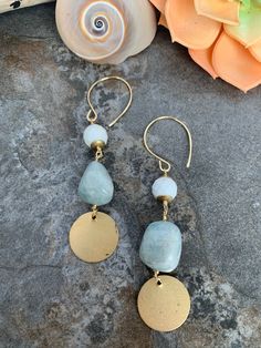 Beachy boho style earrings .. crafted with hand forged ear wires .. faceted White Buffalo Turquoise and tumbled Aquamarine accented with brass coin charms .Thus fun pair measure 3.5 inches in length. Dangle Earrings With Amazonite And Natural Stones, Bohemian Amazonite Earrings As Gift, Bohemian Amazonite Earrings For Gifts, Bohemian Gold Jade Earrings, Handmade Dangle Amazonite Earrings, Handmade Amazonite Dangle Earrings, Bohemian Round Jade Earrings, Bohemian Hammered Dangle Earrings, Handmade Turquoise Amazonite Earrings