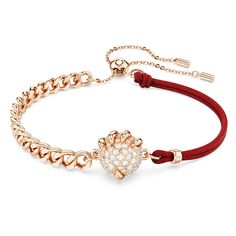 Crafted for the Year of the Dragon, this inspired bracelet is a perfect example of Swarovski savoir-faire. The rose gold-tone plated design features a central dragon’s claw, which holds on tightly to a lucky coin adorned with a pavé of clear crystals. Around the wrist, the bracelet features a linked chain on one side, and red fabric on the other. Bright and energizing, this jewelry would make a perfect gift for a loved one. Phoenix Bracelet, Dragon Phoenix, Dragon Claw, Year Of The Dragon, Clear Crystals, Red Fabric, Bracelets And Charms, The Rose, The Dragon