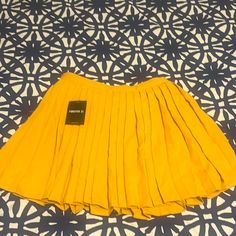 Forever 21 Yellow Mini Skirt. Never Worn! Yellow Pleated Party Bottoms, Yellow Stretch Mini Skirt, Stretch Yellow Mini Skirt, Yellow Stretch Pleated Skirt, Yellow Pleated Stretch Skirt, Yellow Fitted Tennis Skirt For Summer, Stretch Yellow Mini Skirt With Lined Skirt, Yellow Stretch Lined Mini Skirt, Stretch Yellow Mini Skirt With Lining