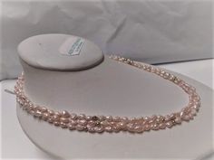 Vintage triple strand pink pearl necklace. It measures 18 inches long and has a 14k gold pearl clasp. The pearls are in the shape of rice krispies. There are round gold beads spread through out the strands. The clasp is stamped 14k. The pearls and gold have not been tested but I believe they are genuine freshwater pearls. Perfect for the bride. Pre owned in great condition. All sales are final and as is. Thank you for looking. You may also love this: https://www.etsy.com/listing/287428311/vintag Pink Pearl Drop Necklace For Formal Occasions, Pink Akoya Pearl Wedding Necklaces, Pink Akoya Pearl Necklaces For Wedding, Pink Akoya Pearl Wedding Necklace, Formal Pink Pearl Drop Necklace, Pink Akoya Pearl Wedding Jewelry, Rice Pearl Necklace, Pink Rice, Quinceanera Jewelry