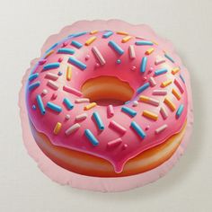 a pink donut with sprinkles on it