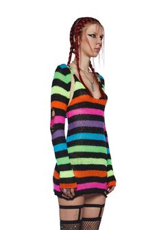 cuz you're one tough cookie.This set includes a mini dress that has a crochet construction, an all over rainbow pattern, shredded detailing, and a matching long sleeve shrug. Multicolor Mini Dress For Winter, Multicolor Mini Dress For Festival, Rainbow Goth Outfit, One Tough Cookie, Crochet Construction, Rainbow Clothes, Current Mood Clothing, Long Sleeve Shrug, Sleeve Shrug