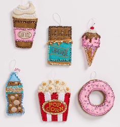 four ornaments made to look like donuts, ice cream, and hotdogs