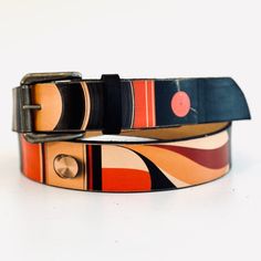 🌼📼 Vintage Styled Leather Belt 🌼📼 MAIN FEATURES * Material: Handmade from 100% Full Grain Vegetable Tanned Leather--this is real leather, crafted using an environmentally friendly tanning process that enhances its durability and beauty. * Buckle: Interchangeable buckle secured with Chicago screws * Design: A one-of-a-kind collage showcasing retro patterns, vinyl records, and stereo elements. 🌟 Lovingly handcrafted by ️ in my UK home studio. Small variations may occur compared to the listed Modern Brown Belt With Brass Buckle, Artisan Leather Belt Buckle With Antique Design, Leather Belts With Antique Buckle For Gift, Vintage Leather Strap Belt For Everyday Use, Vintage Belt Buckles With Belt For Gift, Vintage Belts With Brass Buckle For Everyday Use, Leather Belts And Suspenders With Antique Buckle, Vintage Brown Belt For Gift, Vintage Brown Belt As Gift