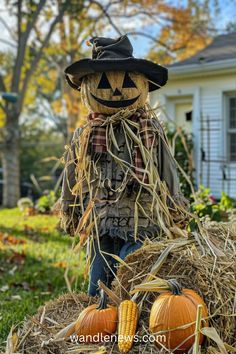 a scarecrow is sitting on top of hay with pumpkins in the foreground