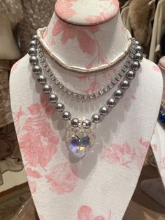 The Cole Necklace is the capsule piece of the Maggie Villamaria brand. Intentionally created to shine bright for your everyday inspiration. Crystal Heart Pendant, Bold Style, Puffy Heart, Shell Beads, Crystal Heart, Silver Pearls, Bold Fashion, Shine Bright, Pearl Jewelry