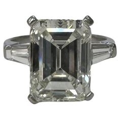 GIA Certified 6.57cts. Emerald Cut Classic Diamond set in Platinum with 2 tapper baguette cut diamonds *Motivated to Sell – Please make a Fair Offer* Specifications: main stone: Diamond 6.57cts. Emerald Cut certification: GIA Certified color: J clarity: SI1 side stones: 2 tapper baguette cut diamonds .40pts. metal: Platinum type: ENGAGEMENT RING SIZE: 5.5 US Engagement Ring Sizes, Baguette Cut Diamond, Expensive Jewelry, Emerald Cut Diamonds, Emerald Cut, Jewelry Rings Engagement, Cut And Color, Colored Diamonds, Ring Verlobung