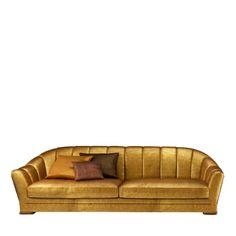 a gold couch with two pillows on it