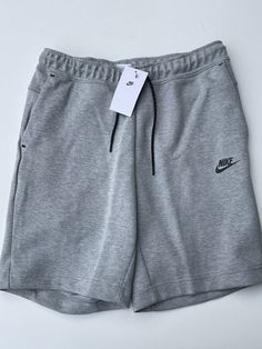 Nike Tech Fleece Shorts are new with tags and 100% authentic. Nike Sports Shorts With Side Pockets, Nike Sportswear Shorts With Side Pockets, Sportswear Bottoms With Pockets For Sports Events, Short Sports Bottoms With Pockets, Sportswear Jogging Shorts With Pockets, Nike Sportswear Shorts For Jogging, Nike Sports Shorts In Gray, Nike Sportswear Jogging Shorts, Nike Gray Sports Shorts