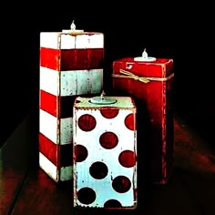 three red and white boxes sitting on top of a table