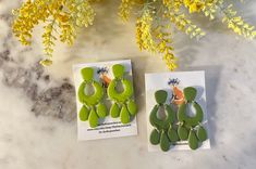 Add a vibrant touch to any outfit with our lightweight Green Dangles. These earrings come in both lime green and olive green, adding a pop of color to your style. With a classy and elegant Moroccan design, you can easily dress up or down with these versatile dangles. Each pair is a one-of-a-kind. Due to the handmade nature of the product, there might be slight variations in pattern, color, or shape compared to the featured photo. All earrings are lightweight and weigh less than a quarter (coin). Trendy Green Drop Earrings, Trendy Handmade Green Earrings, Modern Green Drop Earrings, Green Everyday Earrings, Modern Green Dangle Earrings, Green Hypoallergenic Drop Earrings, Hypoallergenic Green Drop Earrings, Green Summer Earrings For Everyday Wear, Green Everyday Earrings For Summer