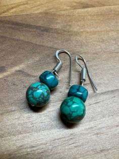 blue and green turquoise-look dangle bead earrings. Handmade in western Nepal by members of a women's literacy project. All proceeds benefit the literacy project. Handmade Southwestern Green Earrings, Green Southwestern Beaded Earrings Gift, Green Southwestern Beaded Earrings For Gift, Southwestern Green Beaded Earrings For Gift, Turquoise Beaded Drop Earrings, Southwestern Green Dangle Earrings, Handmade Southwestern Green Beaded Earrings, Southwestern Green Beaded Dangle Earrings, Green Beaded Dangle Earrings With Natural Stones