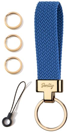 a blue lanyard with two gold rings and three pairs of eyeglasses next to it