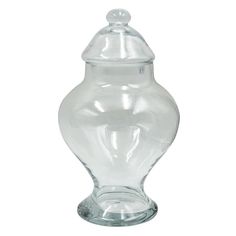 a clear glass vase with a lid