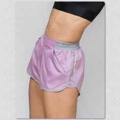 This Lightweight Ripstop Short Is Great For Summer! Two Invisible Smart-Angled Pockets Provide Ample Phone/Wallet/Keys Storage, While A Flat Front Tummy Panel Keeps The Look Sleek. Reflective Side Trim Keeps You Sage By Night And Fabulous By Day. Pair Them With The Matching Hooded Zip Up Jacket 100% Polyester Sz Xs-Xxl Summer Purple Athletic Shorts With Built-in Shorts, Purple Stretch Athletic Shorts For Summer, Purple Athletic Shorts With Pockets For Sports, Purple Athletic Shorts For Gym In Summer, Purple Workout Bottoms With Pockets, Casual Purple Athletic Shorts For Gym, Purple Athleisure Bottoms For Summer, Summer Athleisure Purple Bottoms, Summer Purple Athleisure Bottoms