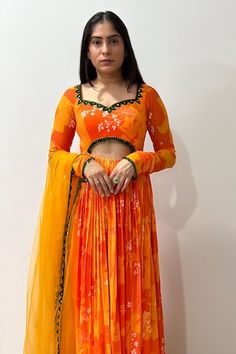 Yellow, orange padded anarkali with bloom print and sequin, mirror, crystal drops embroidered neckline and waist in front. Paired with border embroidered dupatta. - Aza Fashions Orange Choli With Sheer Dupatta For Festivals, Orange Fitted Choli With Resham Embroidery, Fitted Orange Choli With Resham Embroidery, Designer Orange Choli With Sheer Dupatta, Designer Orange Choli With Dupatta, Festive Designer Orange Choli, Orange Anarkali Lehenga With Cutdana, Orange Choli With Cutdana For Festivals, Orange Choli With Sheer Dupatta For Eid