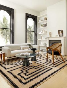 a living room filled with furniture and a fire place in front of a book cover