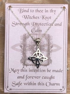 a card with a cross on it that says, blind to the in thy witches knot strength protector and calm may this intention be made and forever caught safe within this charm