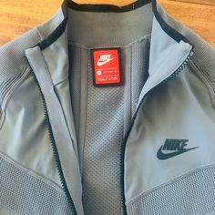 In Very Good Condition. Rarely Worn Xs But Fits More Like A Small Super Rare! Lightweight Material Nike Long Sleeve Outerwear For Light Sports, Functional Nike Track Jacket For Fall, Fall Technical Long Sleeve Track Jacket, Nike Long Sleeve Track Jacket For Light Sports, Nike Sports Outerwear With Ribbed Cuffs, Fitted Sports Track Jacket With Pockets, Nike Gray Outerwear With Ribbed Cuffs, Nike Athleisure Sport Coat For Winter, Nike Track Jacket For Light Sports In Fall