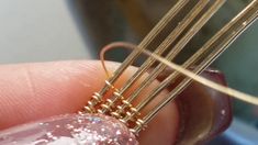 a person holding some kind of wire in their hand