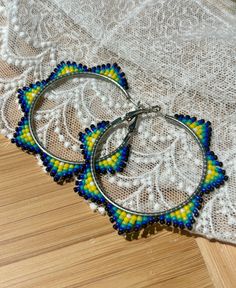 Hand beaded hoop earrings.  Hinge closure. Hoop measures approximately 2" wide. Hoop Earrings Diy, Beaded Beads, Big Hoop Earrings, Handmade Earrings Beaded, Beading Ideas, Earrings Beaded, Beaded Hoop Earrings, Beaded Hoops, Brick Stitch